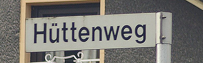 Straßenschild Hüttenweg